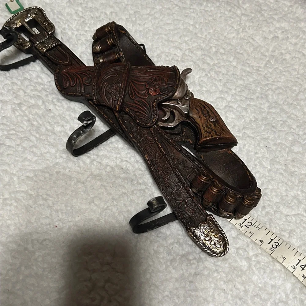 Gun belt wall hanger